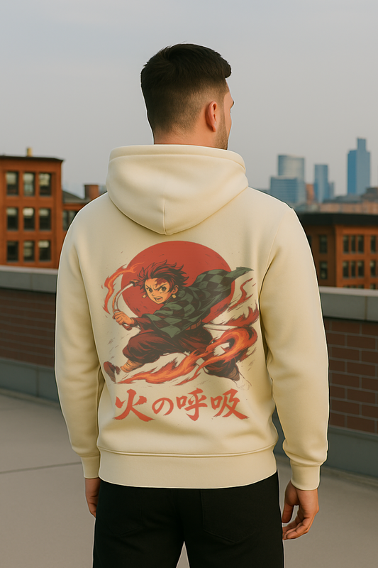 Person wearing a beige hoodie with a graphic design on the back, standing on a rooftop with cityscape in the background.
