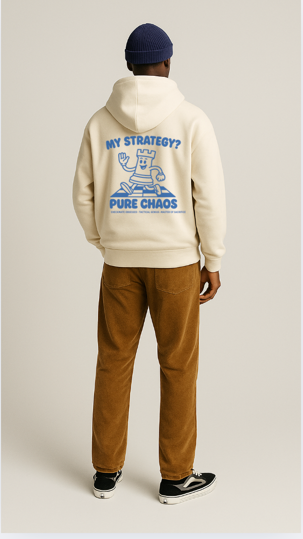 Person wearing a beige hoodie with a graphic design on the back, standing against a plain background